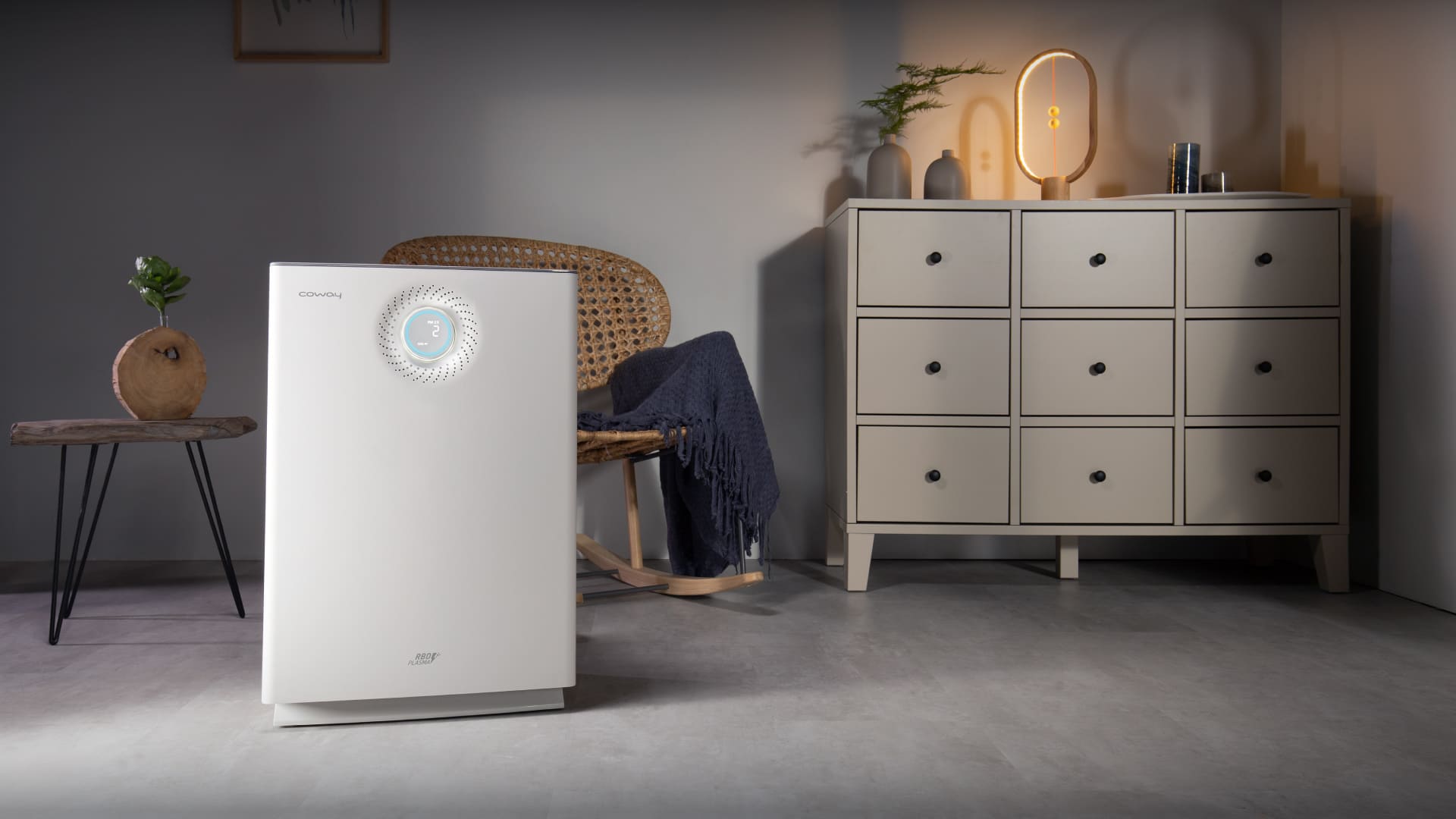 Coway Lombok III air purifier protecting a family living room